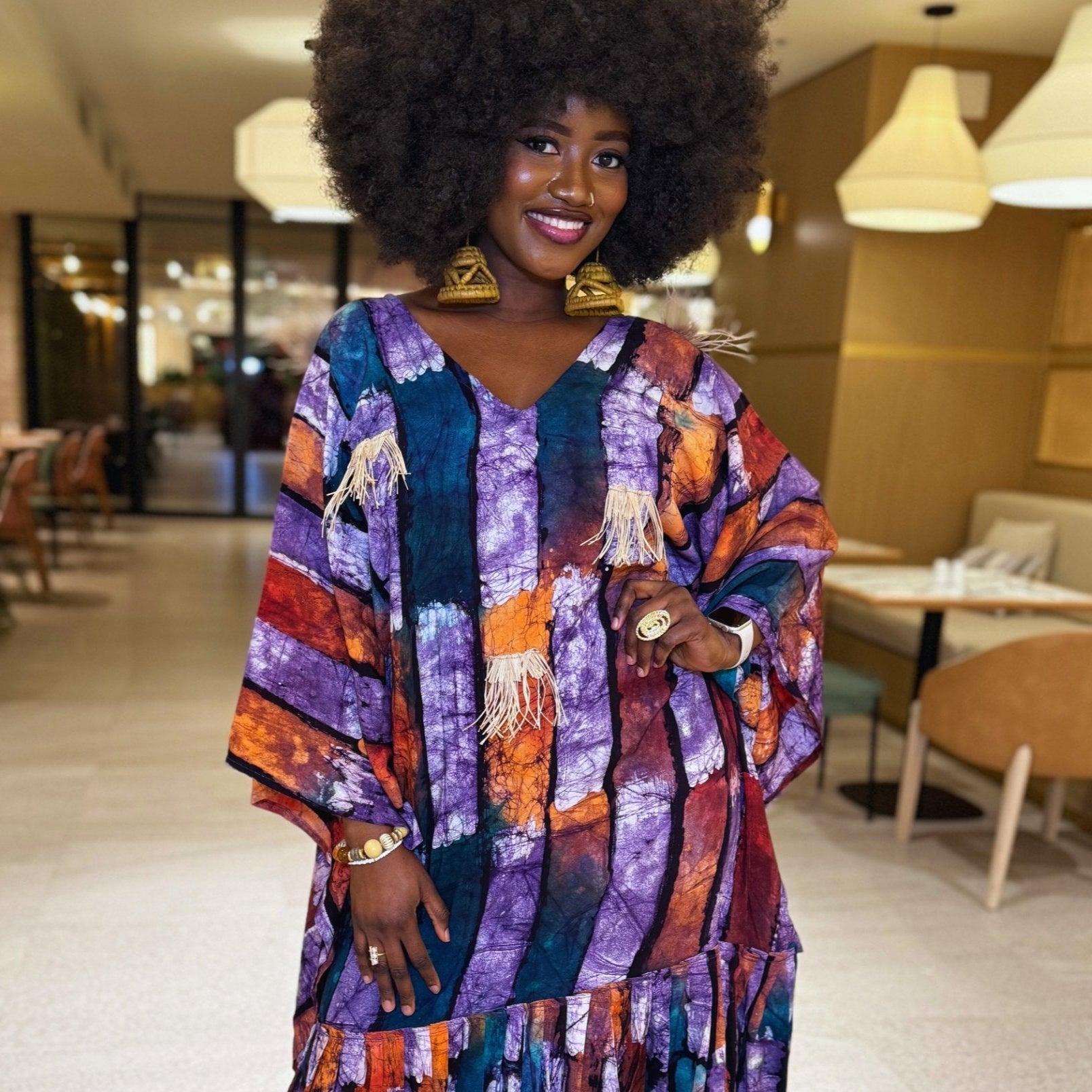Flowy Àbíkẹ́ Kaftan in vibrant purple, orange, green, and red, designed for effortless elegance.