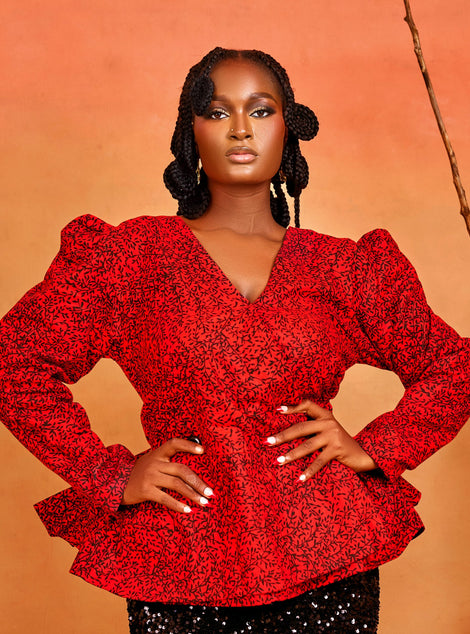 wrap peplum blouse of the Ìfẹ́ Set, featuring red Ankara fabric