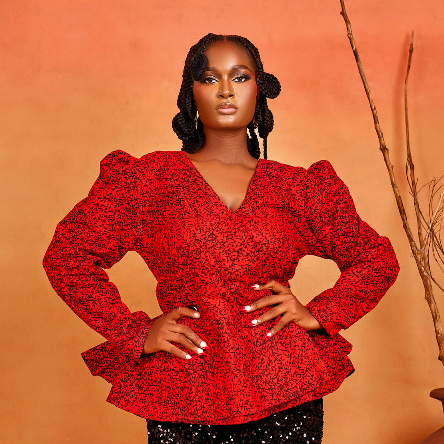 wrap peplum blouse of the Ìfẹ́ Set, featuring red Ankara fabric