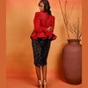 Model wearing the Ìfẹ́ Set, an African-inspired two-piece outfit with a structured peplum top and fitted sequin skirt.