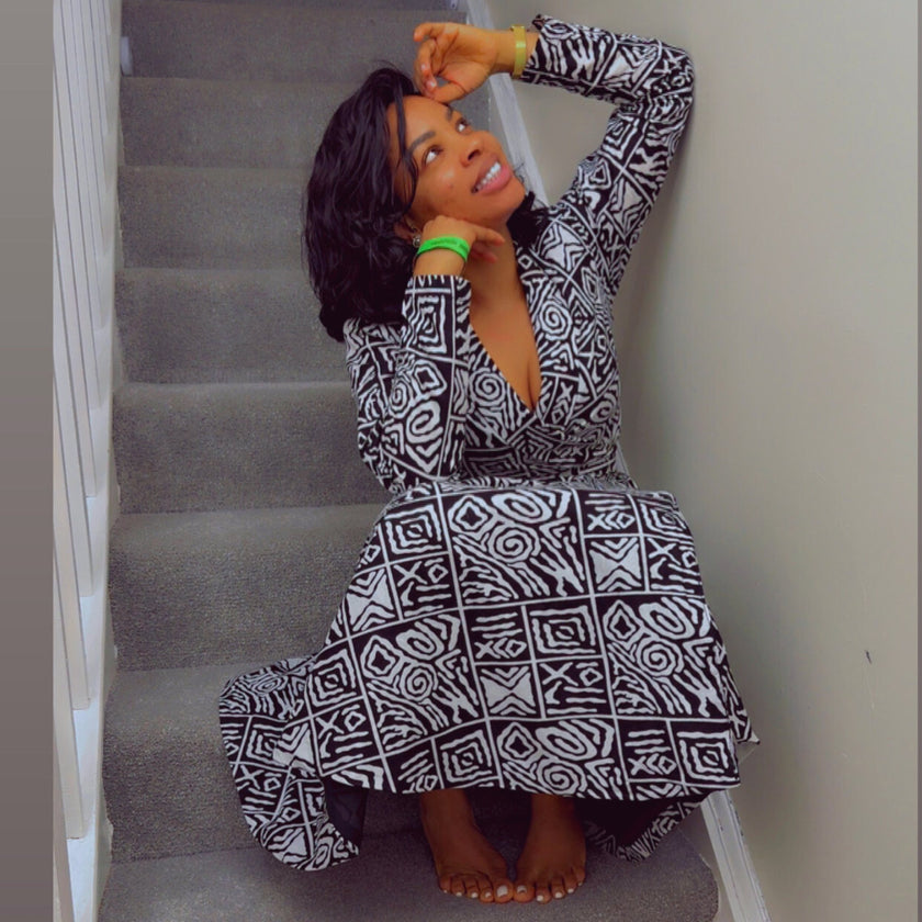 CEO Style in Monochrome Ankara: The Ahoɔfɛ dress worn by the CEO, styled in a classic black and white Ankara print, blends sophisti