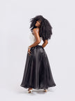 Back-view of a model wearing Amazin Apparels unlined black organdy maxi skirt 