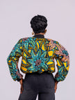 Back view of the Sunflower Bomber Jacket highlighting the large, symmetrical floral print, ribbed neckline and structured fit.