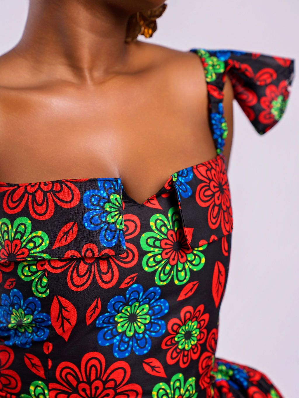 Close-up showing the middle small V-cut and stylish folded details.
