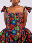 Close-up showing the hip pleating and smooth side panels of the Sculpted Floral Gown, designed for an hourglass silhouette.