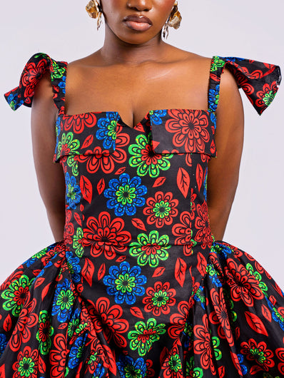 Close-up showing the hip pleating and smooth side panels of the Sculpted Floral Gown, designed for an hourglass silhouette.