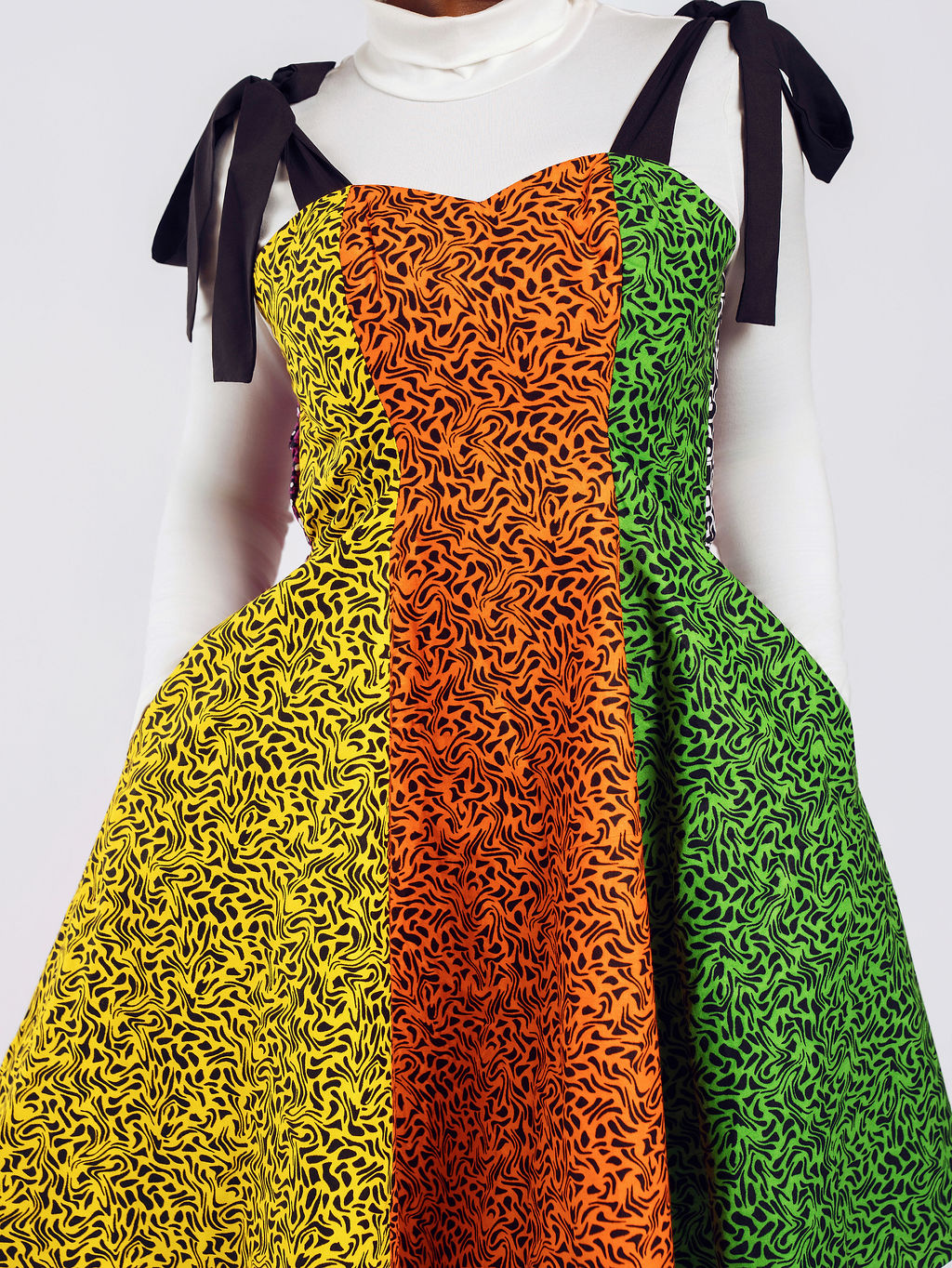 Close-up Front-view of a model wearing Cynthia Colourful Ankara Dress | Amazin Apparels