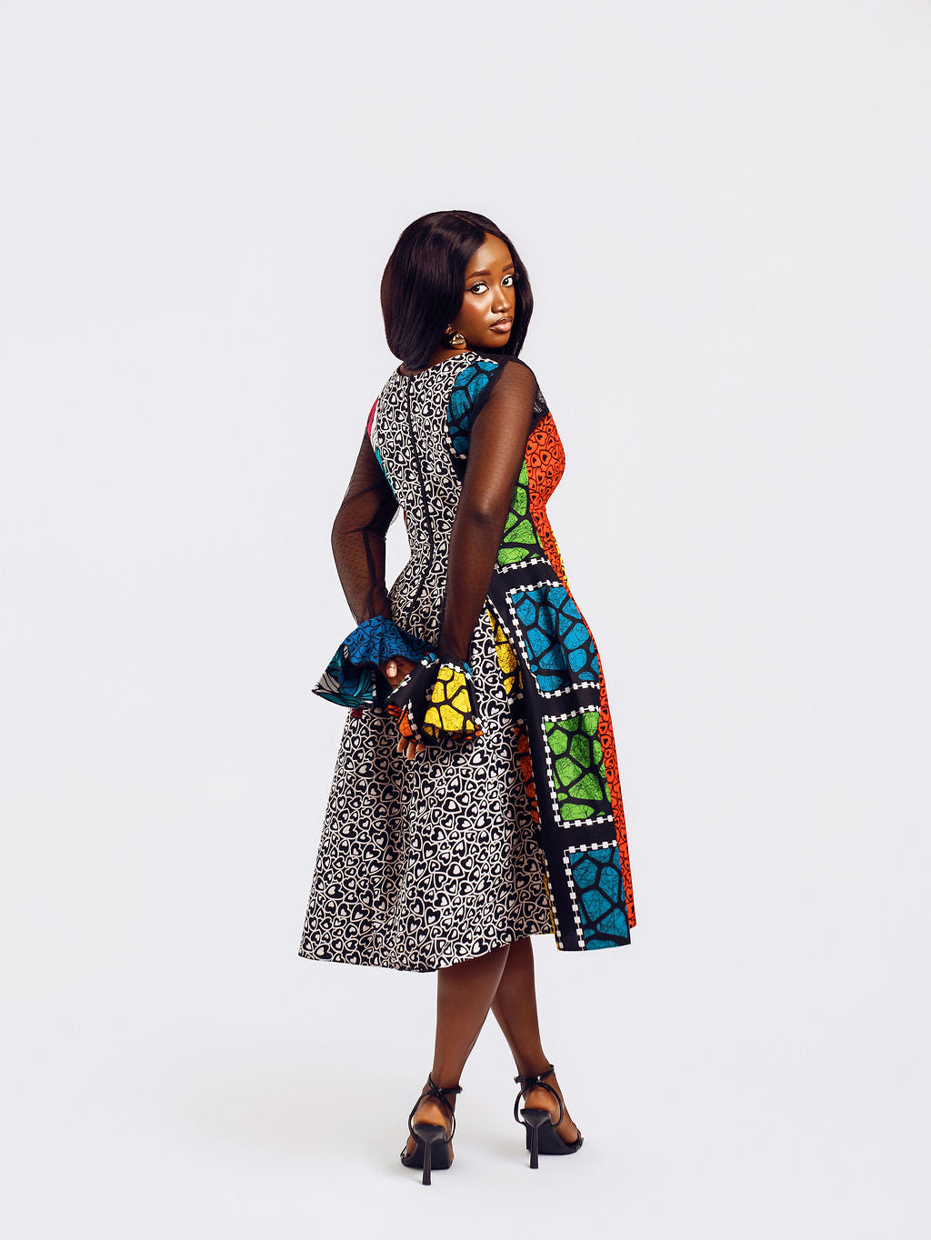 Back-view of a model wearing Doris Mixed Ankara Print Dress | Amazin Apparels - AmazinApparels