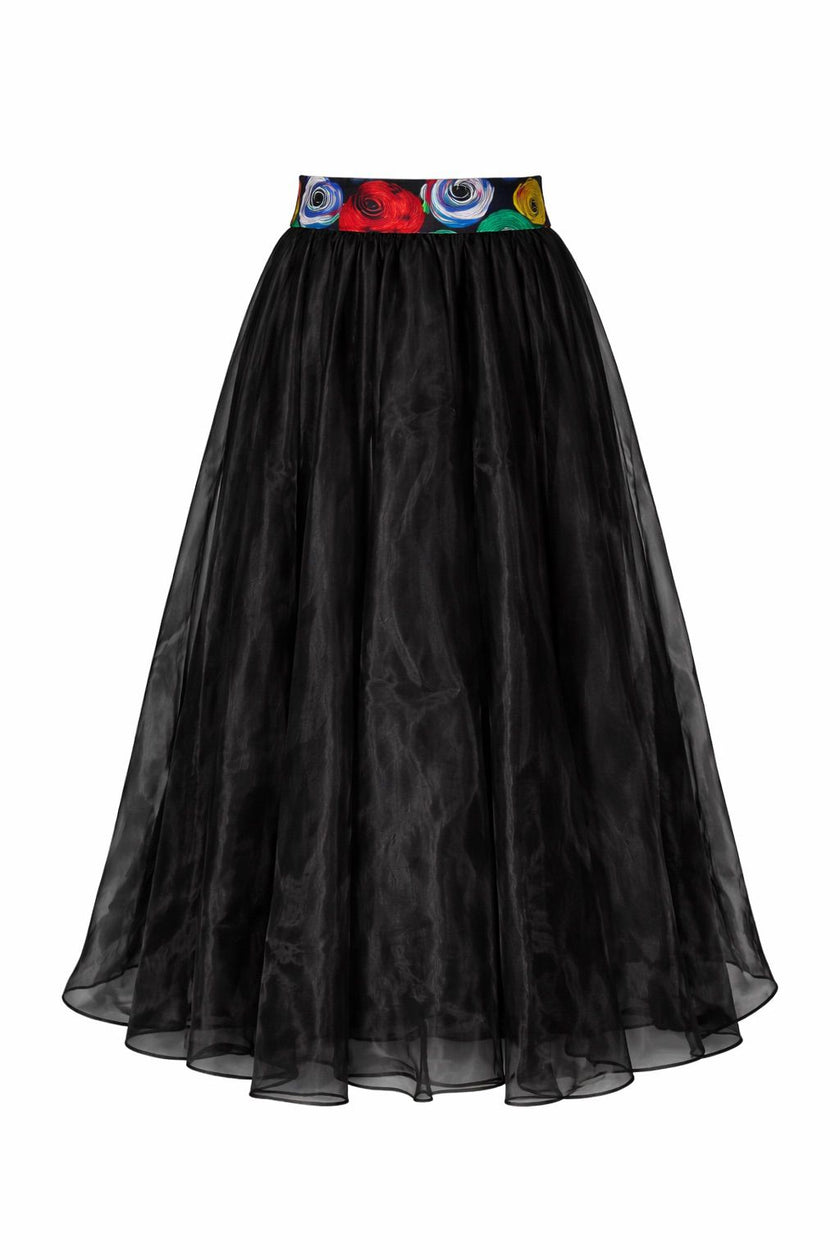 Front view of a sheer, unlined black organdy maxi skirt with two hidden pockets on both side, on a white background.
