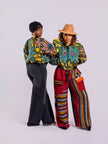 Two women wearing colorful African-inspired crop bomber jacket on a white background