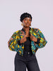 Front view of a cropped bomber jacket with showing the ribbed neckline and the two hand ribbed cuff. 