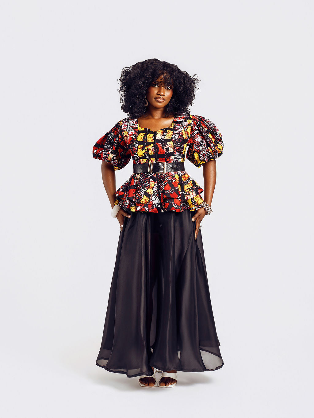 Front-view of a model wearing the Seyi Ankara Peplum Top 