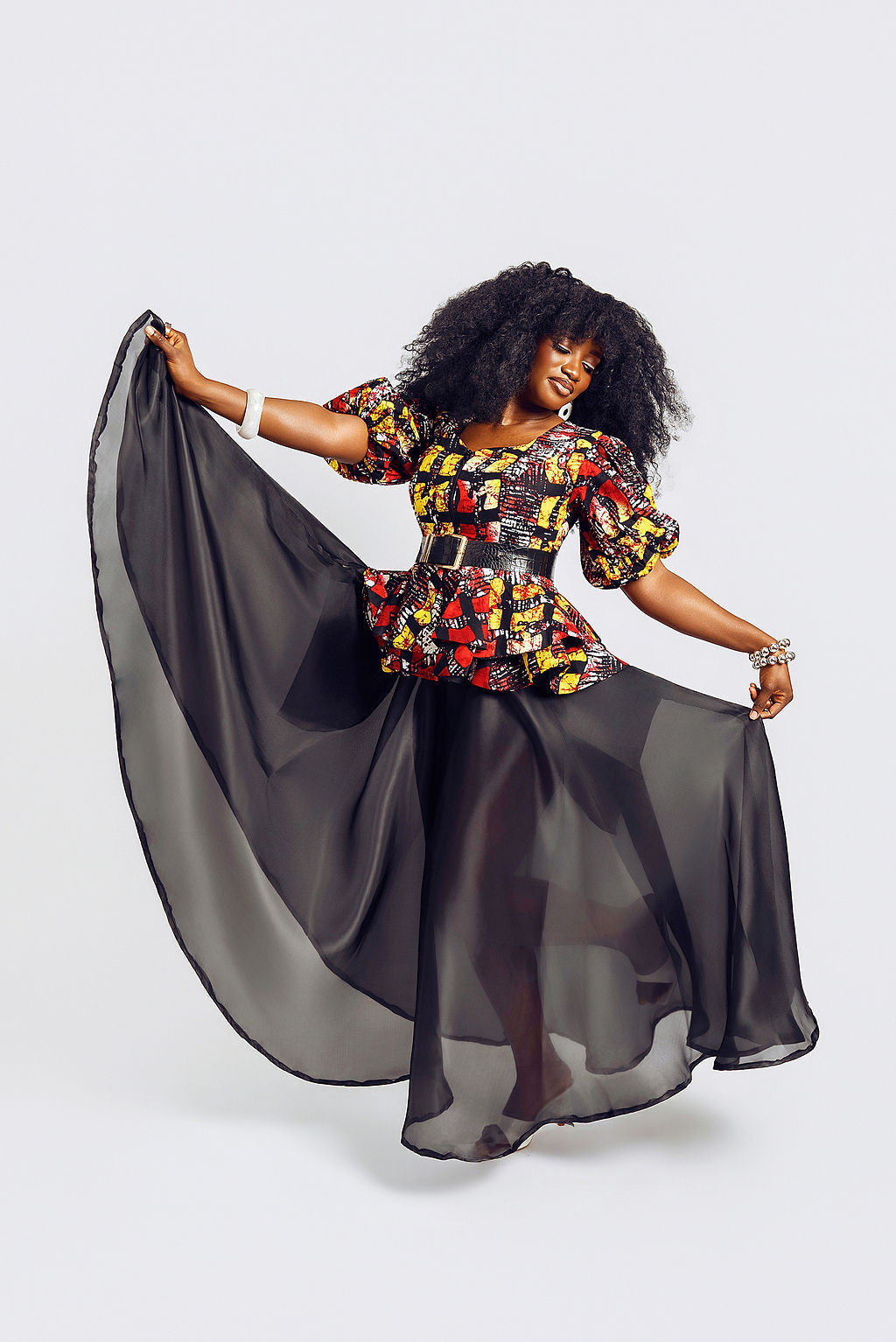 Front-view of a model wearing the Seyi Ankara Peplum Top 