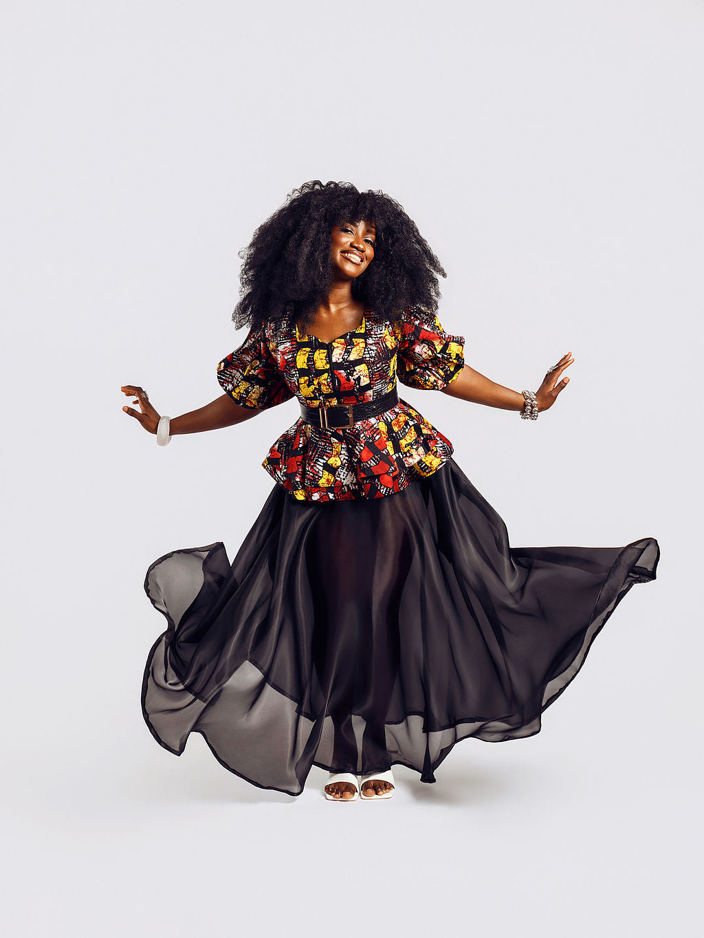 Front-view of a model wearing the Seyi Ankara Peplum Top 
