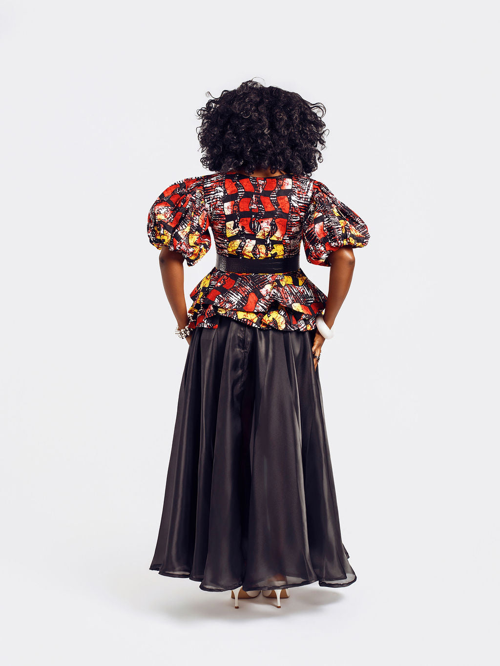 Back-view of a model wearing the Seyi Ankara Peplum Top 