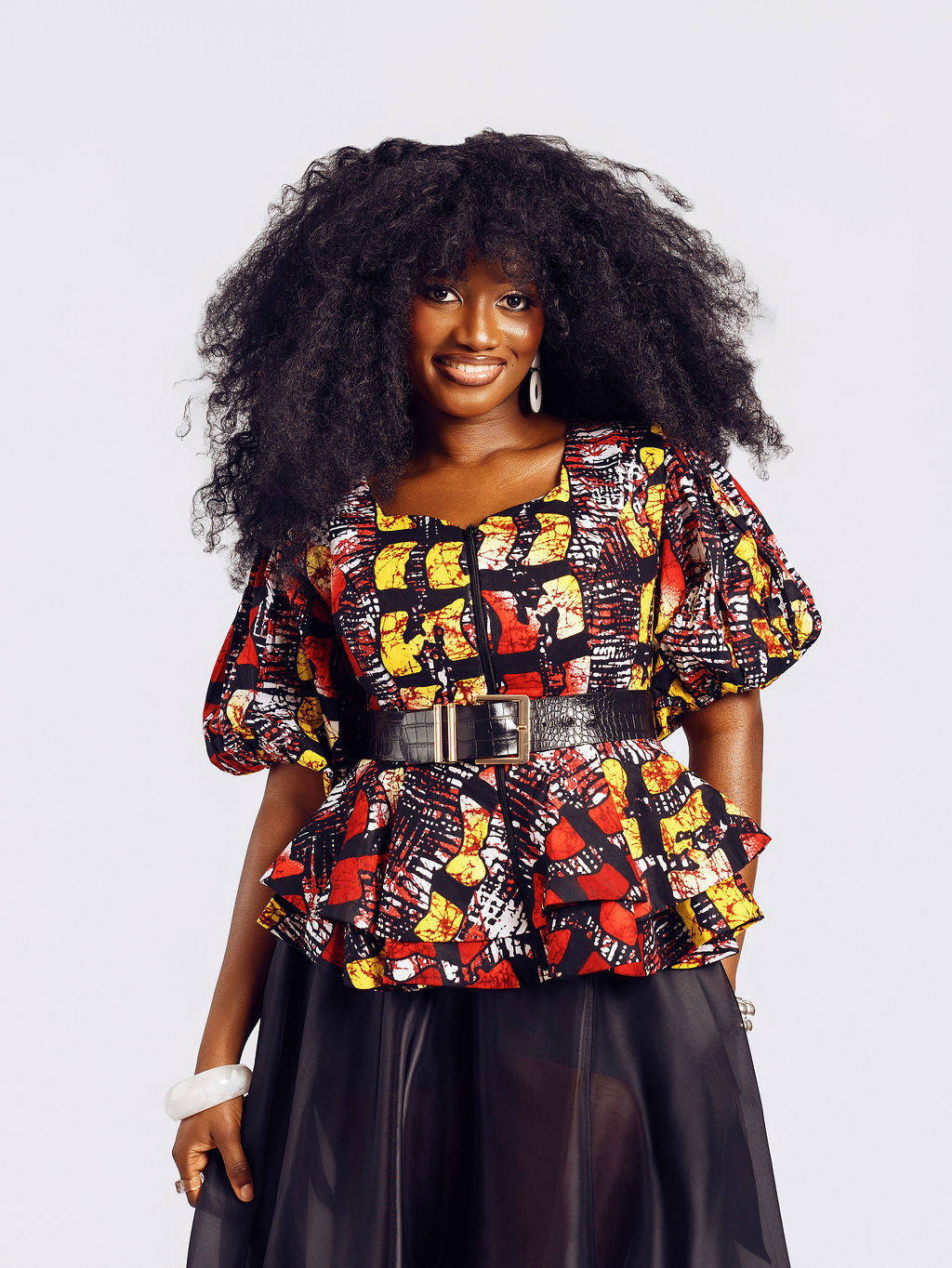 Close-up Front-view of a model wearing the Seyi Ankara Peplum Top 