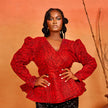 wrap peplum blouse of the Ìfẹ́ Set, featuring red Ankara fabric