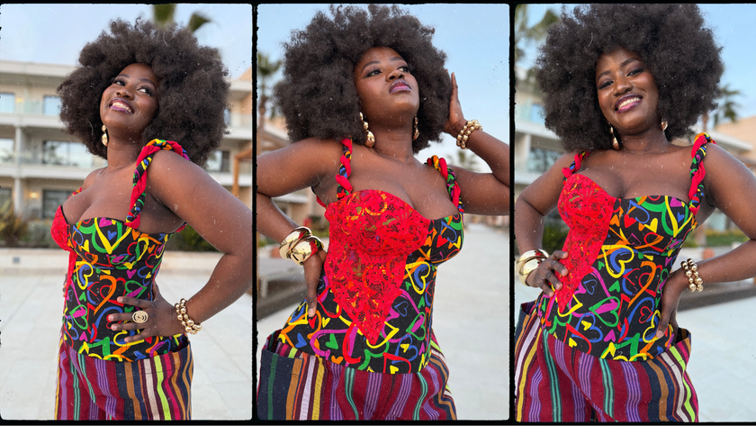 Model showcasing the Ànìké Ankara corset blouse from multiple angles, highlighting the sweetheart neckline, braided straps, structured silhouette, and lace-up back. Handmade from vibrant multicoloured African print heart-patterned cotton, this bustier top offers a flattering fit and stylish detail, perfect for weddings, parties, cultural celebrations, and evening events.