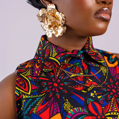 Detailed close-up of the high pointed shirt collar and button-down front of the floral Kaleidoscope Gown by Amazin Apparels.